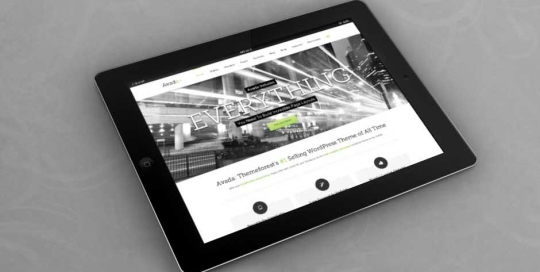 Tablet displaying an industrial-themed website with modern design.